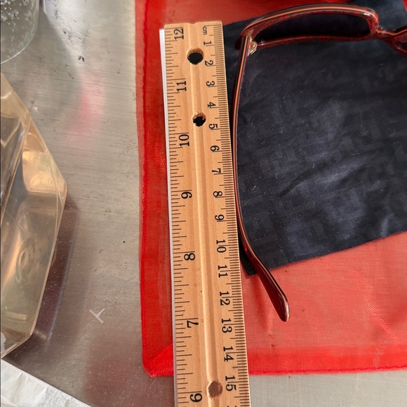 vintage Fendi  sunglasses, specifically model FS347 in a burgundy/red color. main image 9